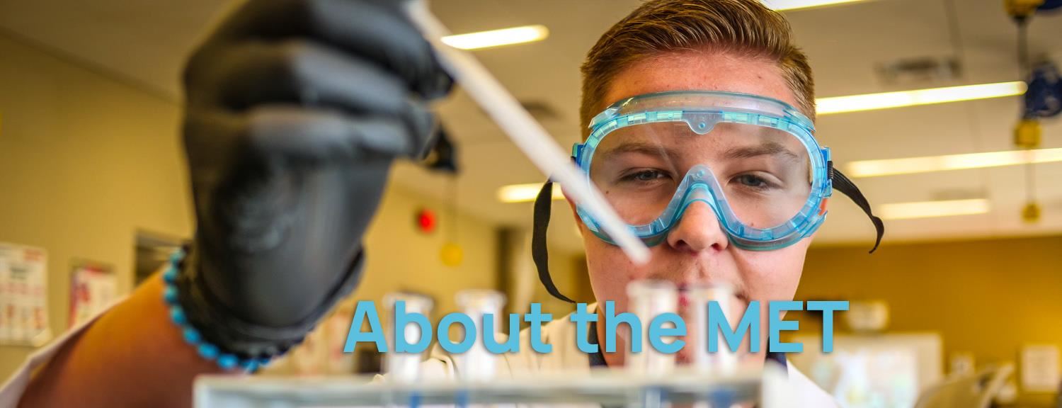 Student in safety gear collects liquids in a pipette. Text: About the MET